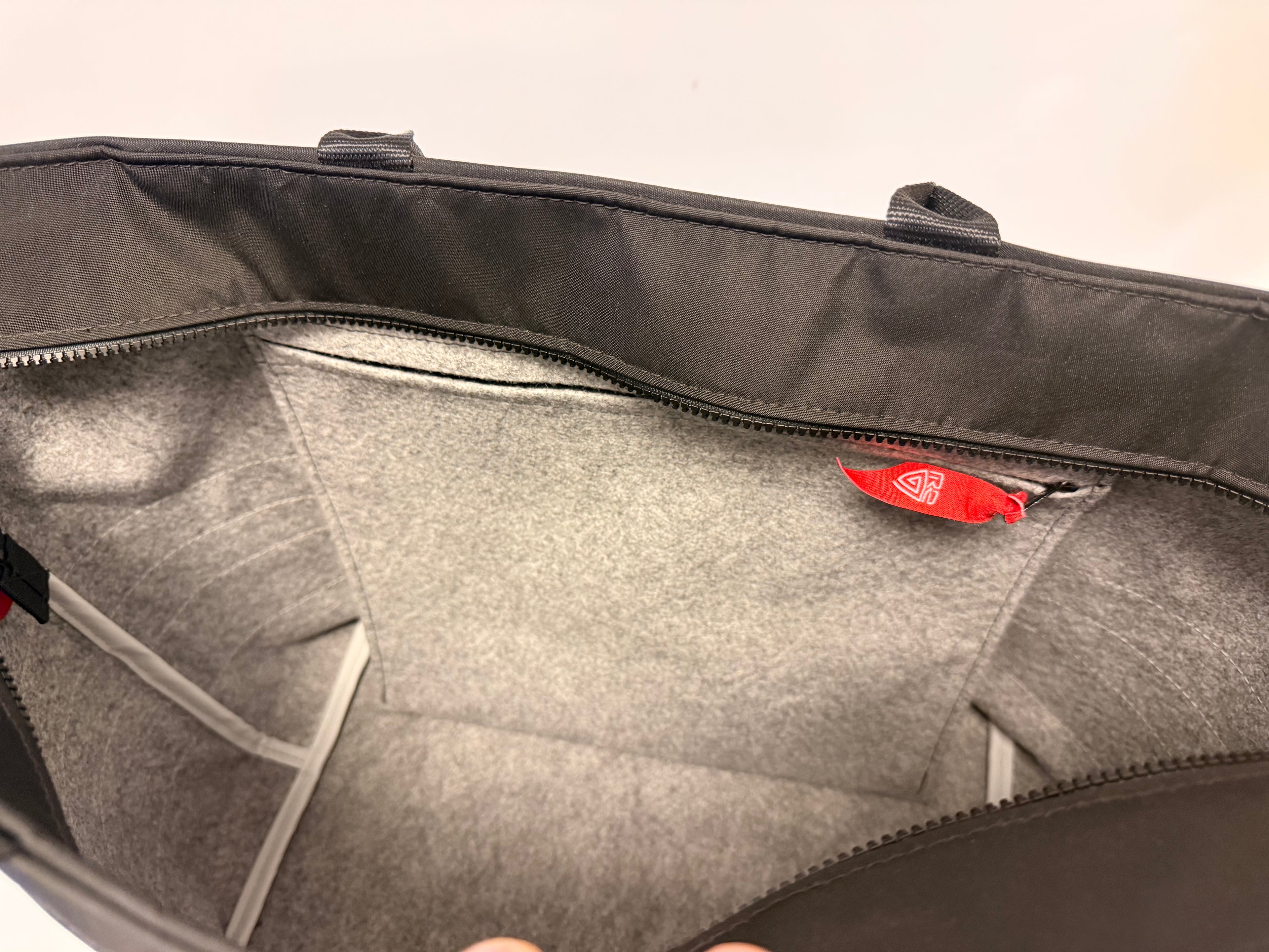 Weekend bag with closingtop and reflex panels